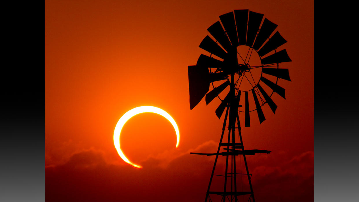  Annular eclipse with windmill at sunset. 