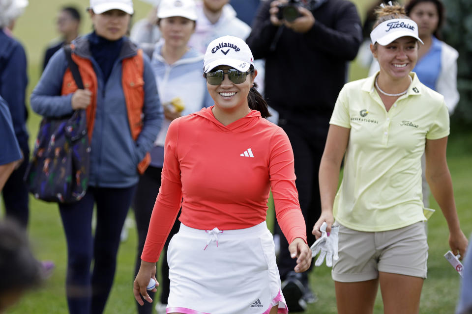 Rose Zhang, center, walks to the fourth hole tee box with Anna Davis, right, during the final round of the Mizuho Americas Open golf tournament, Sunday, June 4, 2023, in Jersey City, N.J. (AP Photo/Adam Hunger)