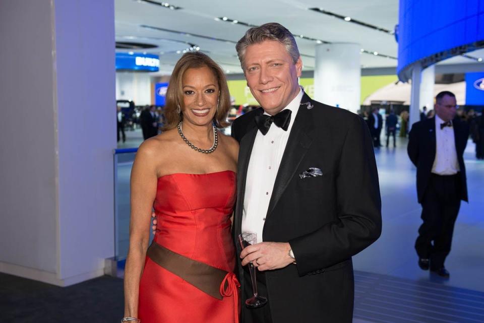 Anchors Carmen Harlan, since retired, and Devin Scillian pose by the Ford booth at the North American International Auto Show Charity Preview -- car prom -- before going on the air for WDIV-TV (Channel 4). (Photo: Detroit Free Press)