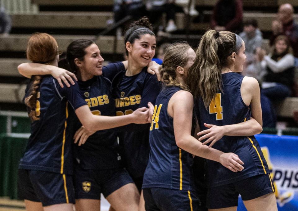 Our Lady of Lourdes celebrates after defeating Walt Whitman 60-51 in a New York State girls Class AAA basketball semifinal against at Hudson Valley Community College in Troy March 16, 2024.