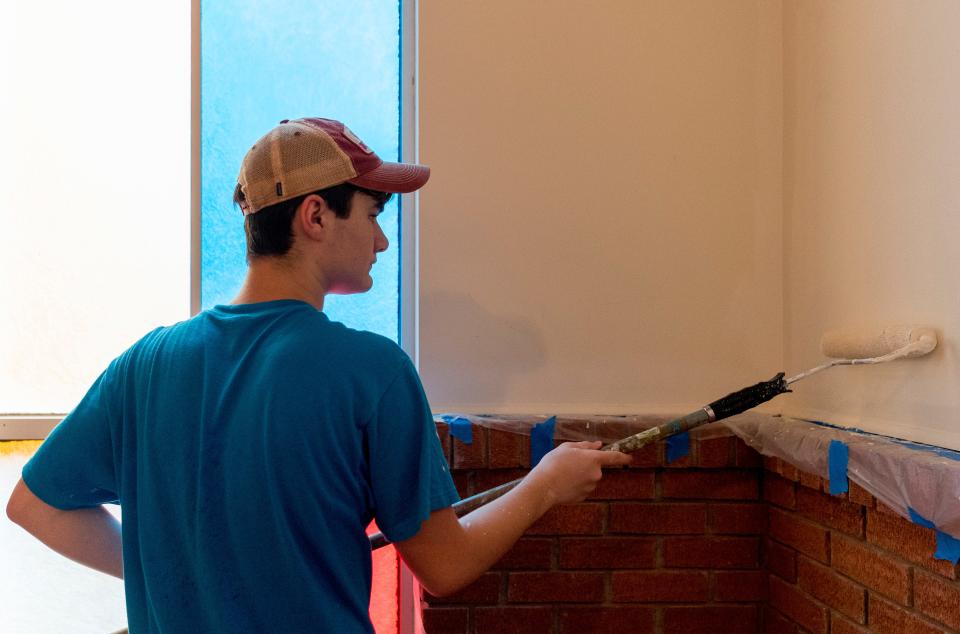 Volunteer Andrew Barrow of Cumberland, Miss., applies paint at Calvary Missionary Baptist Church while working with World Changers in Henderson, Ky., Friday morning, June 17, 2022.