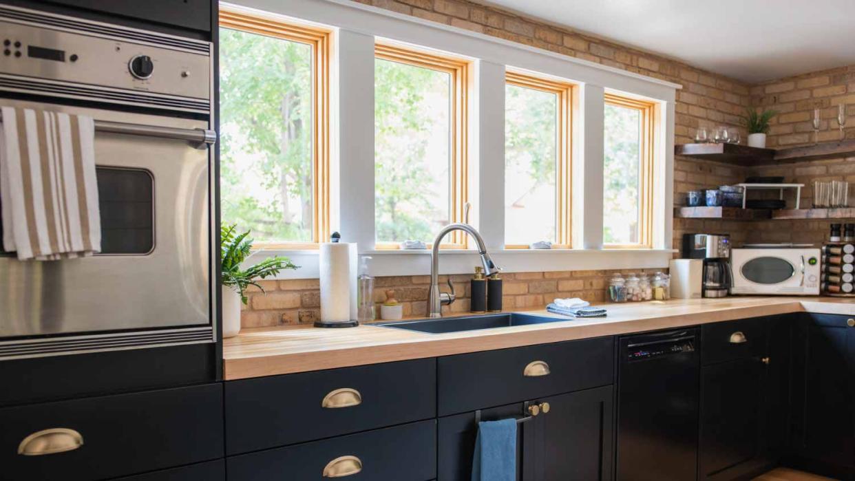 A kitchen with daylight shining through windows