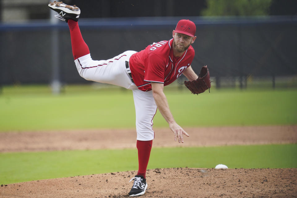 Washington Nationals pitcher Stephen Strasburg throws live batting practice during the team's spring training baseball workout, Tuesday, March 15, 2022, in West Palm Beach, Fla. (AP Photo/Sue Ogrocki)