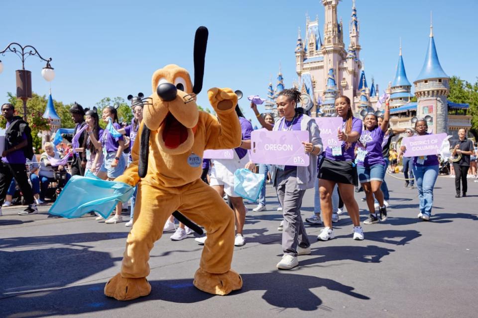 Disney Dreamer Academy students march down Main Street U.S.A. on Thursday at Magic Kingdom in a celebratory parade to kick off Disney Dreamers Academy at Walt Disney World Resort in Lake Buena Vista, Florida. (Charlene Morrison, photographer)