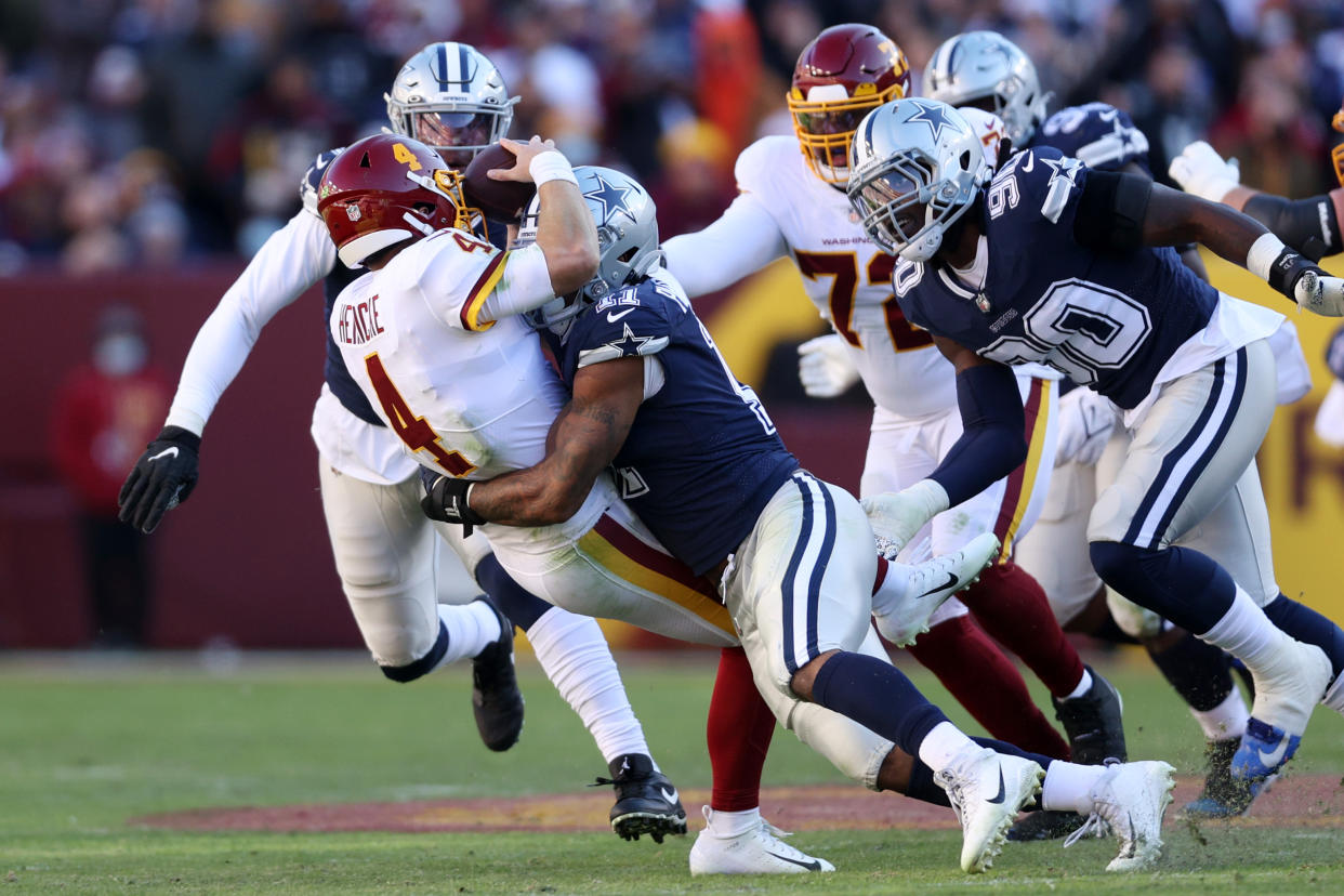 Micah Parsons of the Dallas Cowboys forces Taylor Heinicke to fumble, and it was returned by Dallas for a touchdown. (Photo by Rob Carr/Getty Images)