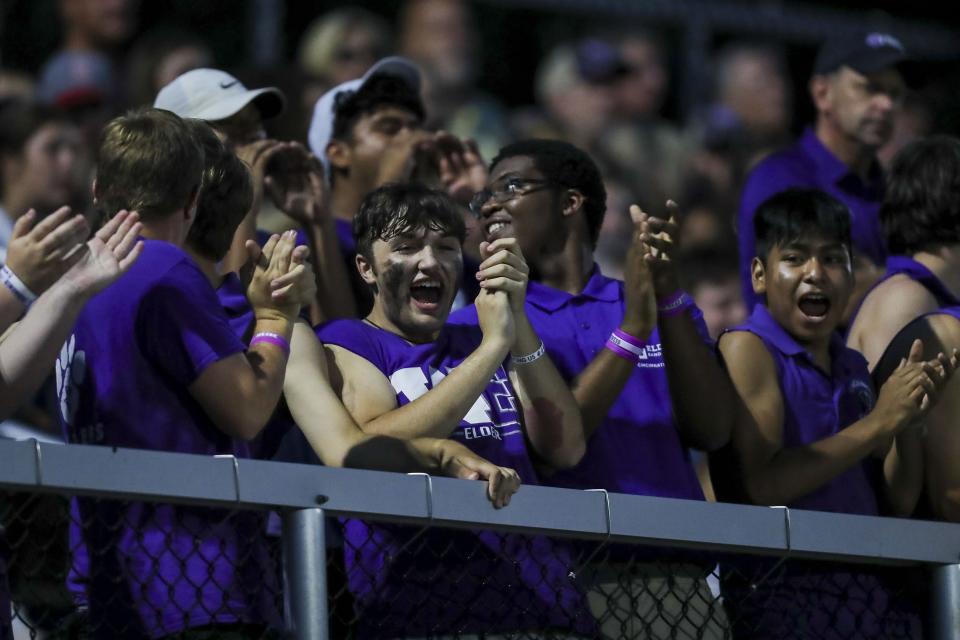 The Elder cheering section cheers during the second half in the game against Covington Catholic at Covington Catholic High School Aug. 19, 2022.