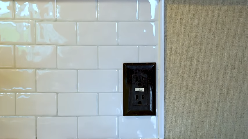 Peel and stick tiles on the kitchen wall