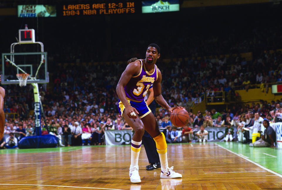 BOSTON, MA - JUNE 1984: Earvin Magic Johnson #32 of the Los Angeles Lakers dribbles the ball up court against the Boston Celtics during the 1984 NBA Basketball Finals at the Boston Garden in Boston, Massachusetts. The Celtics won the Championship 4 games to 3.  Johnson played for the Lakers from 1979-91 and 96. (Photo by Focus on Sport/Getty Images) 