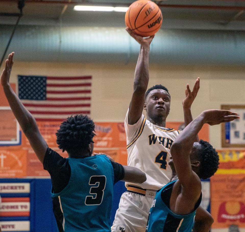 Winter Haven's Isaac Celiscar goes up for a shot against Olympia on Saturday at the Mosaic 2022 Stinger Shootout at Bartow High School.