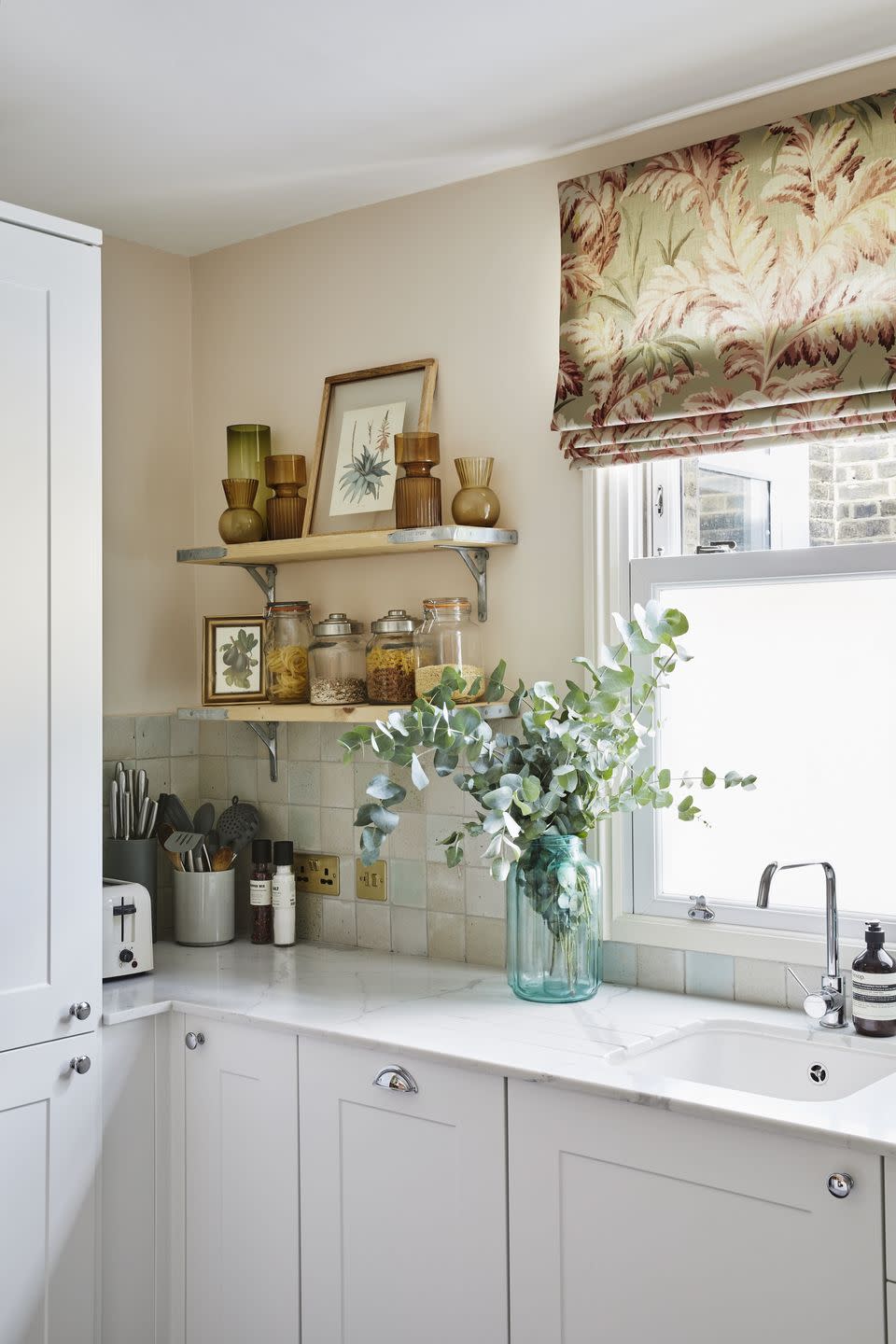 kitchen with upcycled scaffold shelves and opaque frosted window