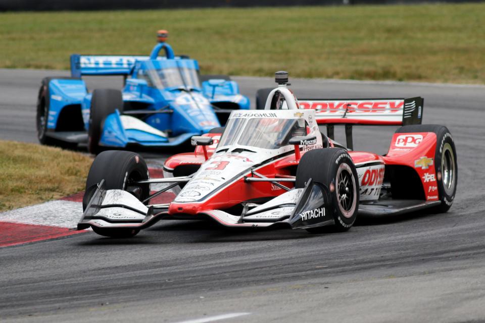 Scott McLaughlin leads Alex Palou through a corner during an IndyCar auto race at Mid-Ohio Sports Car Course in Lexington, Ohio, Sunday, July 3, 2022.