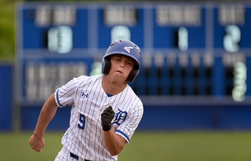 Joey Brink of Dundee races off to third base against Whiteford.