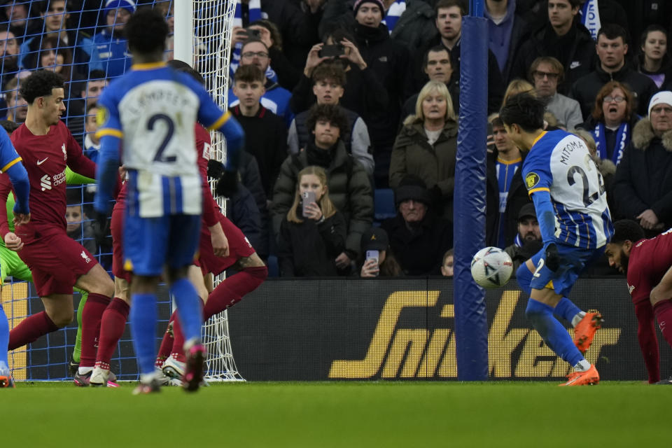 Brighton's Kaoru Mitoma, right, scores his side's second goal during the FA Cup 4th round soccer match between Brighton and Hove Albion and Liverpool at the Falmer Stadium in Brighton, England, Sunday, Jan. 29, 2023. (AP Photo/Alastair Grant)