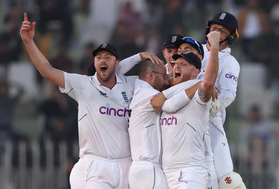 Seen here, Ben Stokes and his England teammates celebrate their incredible first Test triumph against Pakistan in Rawalpindi. 