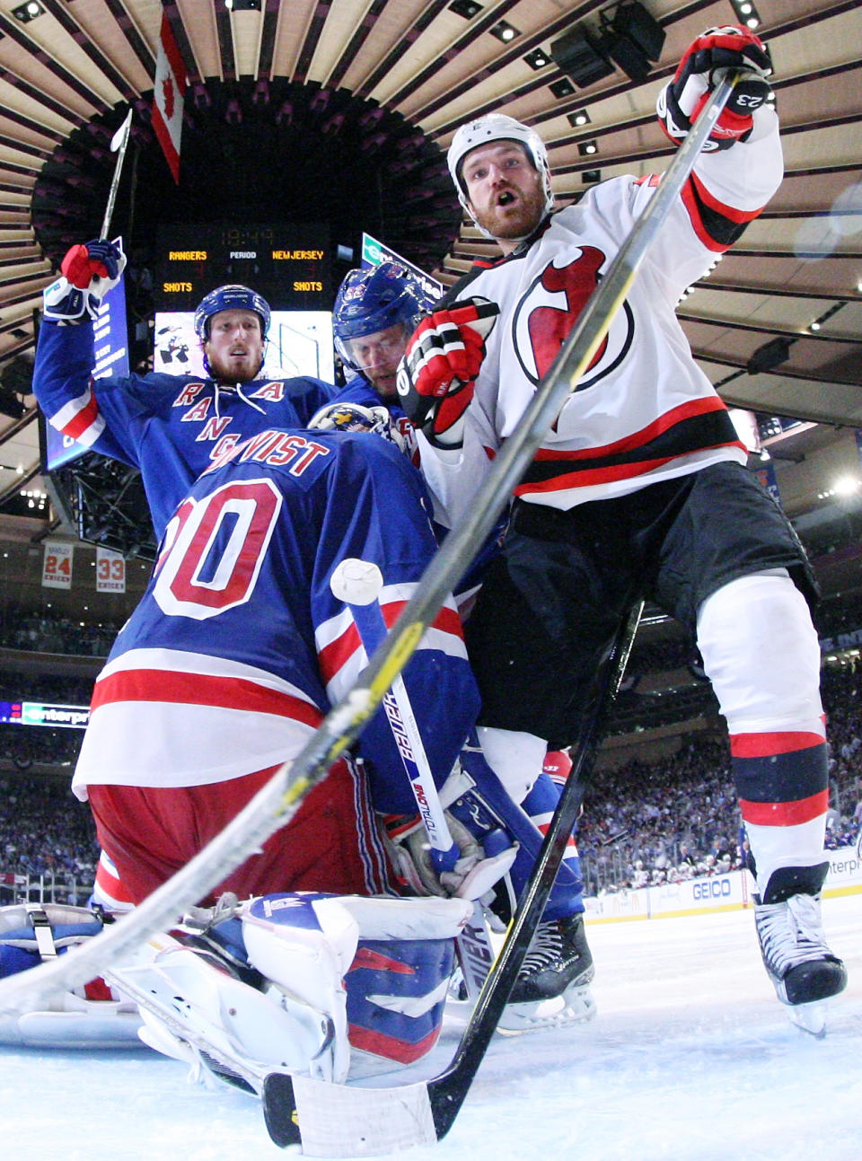 NEW YORK, NY - MAY 23: Henrik Lundqvist #30 of the New York Rangers defends against David Clarkson #23 of the New Jersey Devils in the third period of Game Five of the Eastern Conference Final during the 2012 NHL Stanley Cup Playoffs at Madison Square Garden on May 23, 2012 in New York City. (Photo by Bruce Bennett/Getty Images)