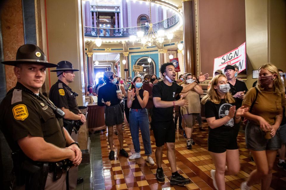 Matthew Bruce leads a group of Black Lives Matter activists at the Iowa State Capitol on June 29, 2020, calling for Gov. Kim Reynolds to sign an executive order to allow felons in Iowa to vote.