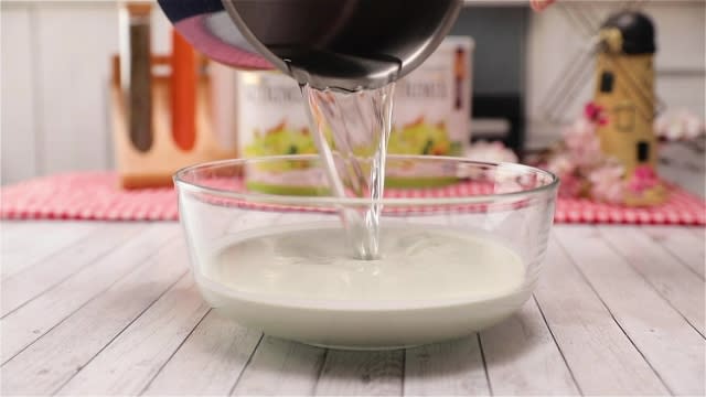 Pouring sugar syrup into nutrimix avocado batter