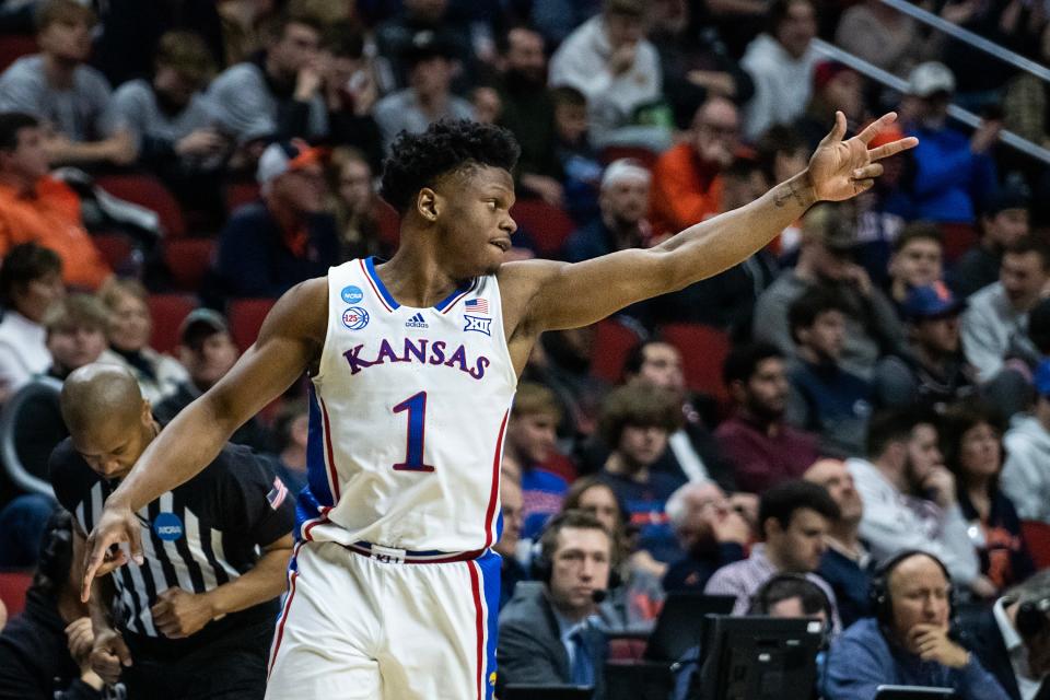 Kansas' Joseph Yesufu celebrates scoring a basket during a NCAA tournament game Thursday between Kansas and Howard at Wells Fargo Arena in Des Moines, Iowa.