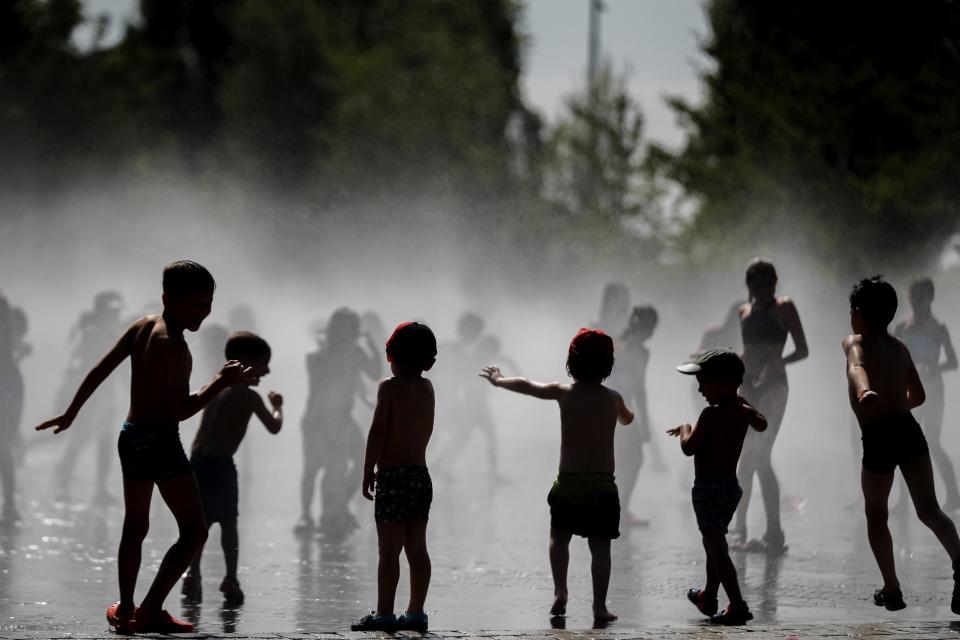 Crowds rushed to cool off where they could (EPA)