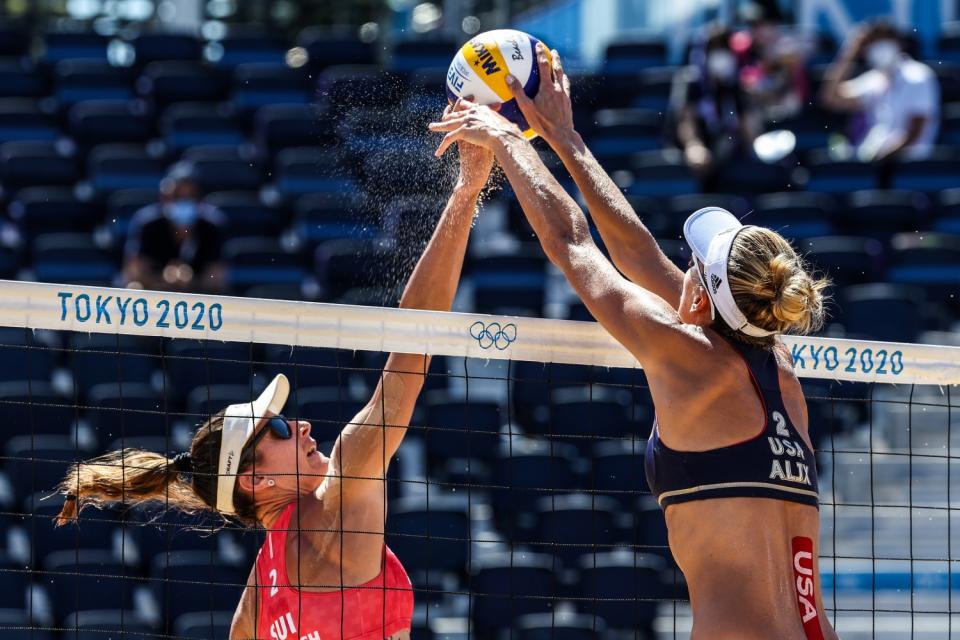 Alix Klineman, right, blocks the spike by Switzerland's Joana Heidrich during Thursday's semifinal match.