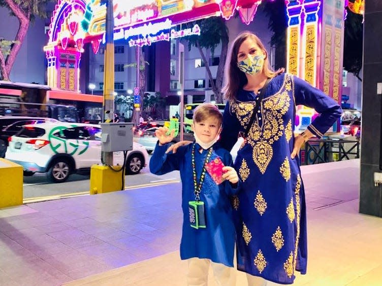 Woman with her child posing for a picture in Little India Singapore wearing traditional Indian clothing