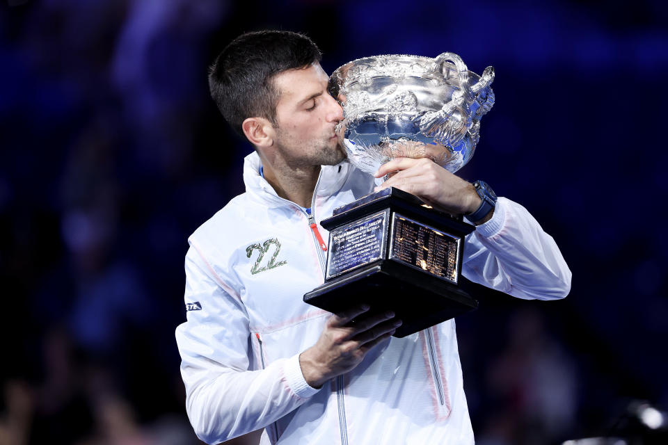 Novak Djokovic (pictured) kissing the Australian Open trophy.