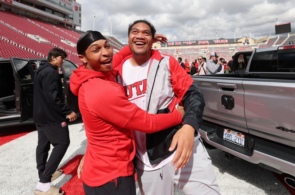 Utah Utes scholarship football players Micah Bernard, left, and Johnny Maea celebrate getting a Dodge truck given to them by the Crimson Collective during an NIL announcement at Rice-Eccles Stadium in Salt Lake City on Wednesday, Oct. 4, 2023. | Jeffrey D. Allred, Deseret News