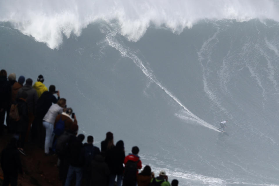 Sebastian Steudtner from Germany rides a wave during the Nazare Tow Surfing Challenge at Praia do Norte or North Beach in Nazare, Portugal, Tuesday, Feb. 11, 2020. (AP Photo/Armando Franca)