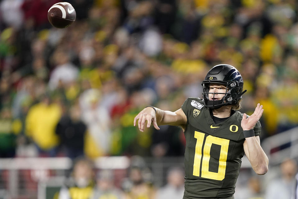 Oregon quarterback Justin Herbert (10) was picked by the Los Angeles Chargers. (AP Photo/Tony Avelar)