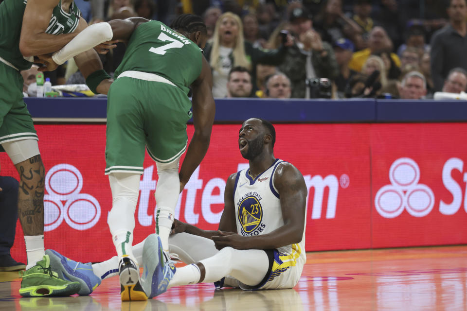 Golden State Warriors forward Draymond Green reacts toward Boston Celtics guard Jaylen Brown during Game 2 of the 2022 NBA Finals in San Francisco on June 5, 2022. (AP Photo/Jed Jacobsohn)