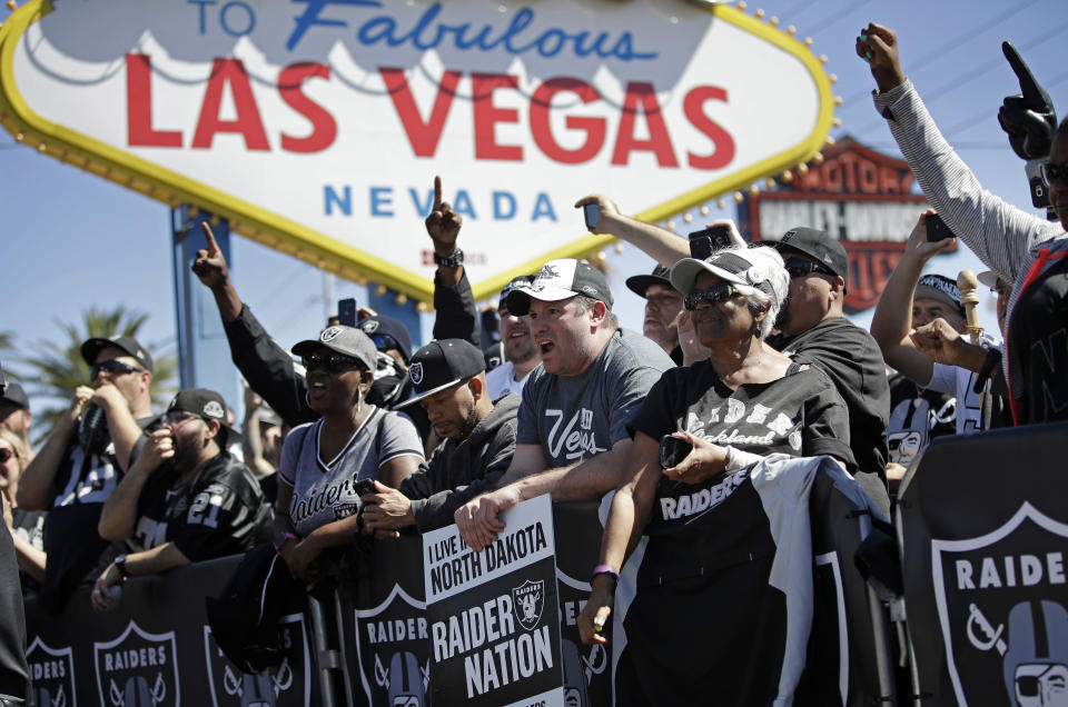 FILE - Fans cheer as the Oakland Raiders announce their fourth round draft pick during an NFL football draft event in Las Vegas, April 29, 2017. Las Vegas oddsmakers had argued for years that sports betting is easier to monitor where it's legal and regulated. (AP Photo/John Locher, File)