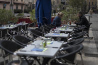Diners eat lunch before the closure of restaurants and bars, in Marseille, southern France, Sunday Sept. 27, 2020. As restaurants and bars in Marseille prepared Sunday to shut down for a week as part of scattered new French virus restrictions, Health Minister Olivier Veran insisted that the country plans no fresh lockdowns. (AP Photo/Daniel Cole)