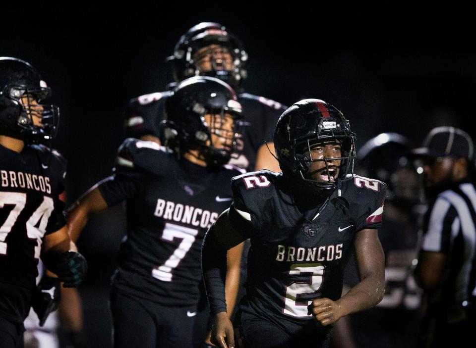 Palm Beach Central's Nedrick Boldin, (2) and Preston Parker, (7) celebrate in the endzone during their game against Benjamin in Wellington, Florida on October 6, 2023.