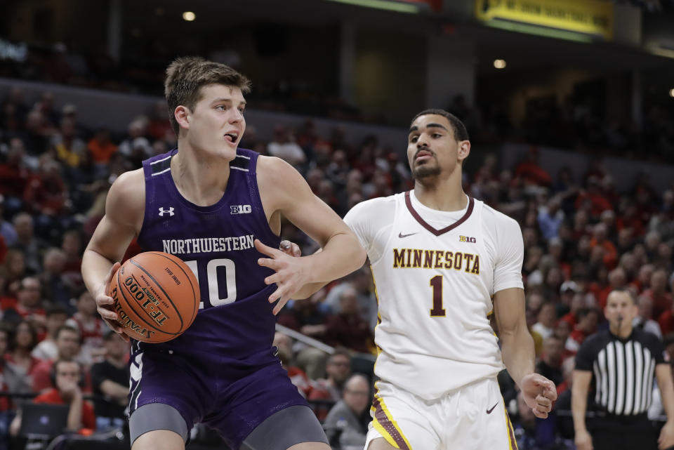 Northwestern's Miller Kopp (10) goes to the basket against Minnesota's Tre' Williams (1) during the second half of an NCAA college basketball game at the Big Ten Conference tournament, Wednesday, March 11, 2020, in Indianapolis. Minnesota won 74-57. (AP Photo/Darron Cummings)