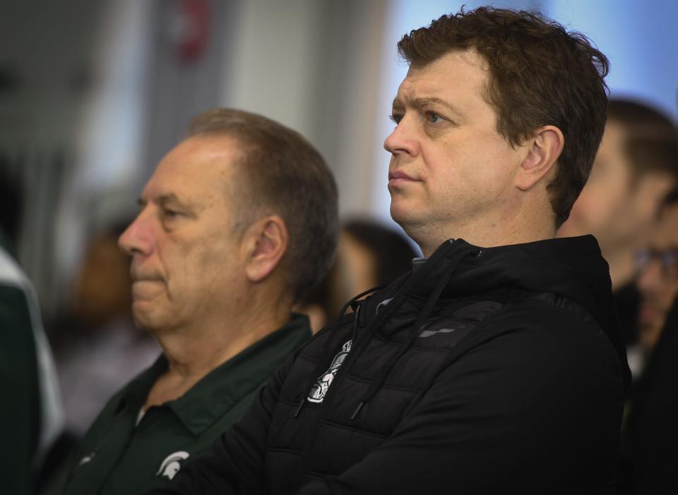 Michigan State University Men's Basketball Coach Tom Izzo, left, and MSU Hockey Coach Adam Nightingale listen as new Women's Basketball Coach Robyn Fralick speaks during her first press conference Tuesday, April 4, 2023, at the Breslin Center Hall of History in East Lansing.