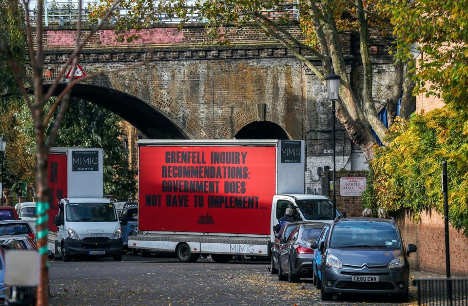 Three billboards by Campaign group Justice4Grenfell drive to and from Grenfell Tower in west London on the day the first report from the public inquiry into the fire which claimed 72 lives is published (PA)