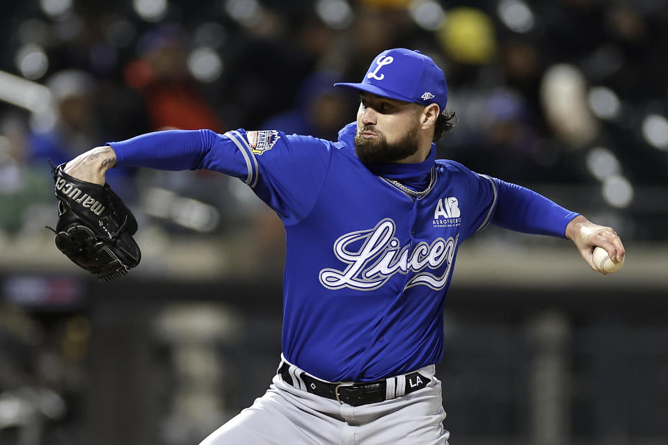 Los Tigres del Licey's Logan Allen throws against Águilas Cibaeñas during the first inning of a Dominican Winter League baseball game Friday, Nov. 10, 2023, in New York. (AP Photo/Adam Hunger)