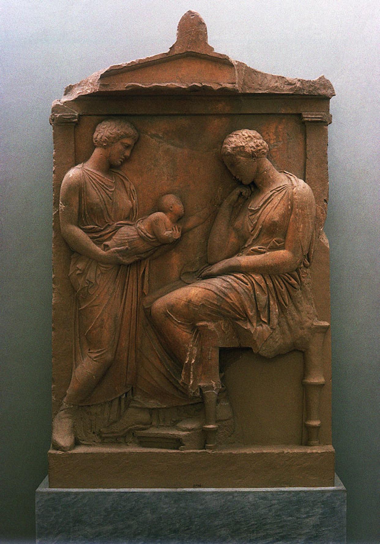 An ancient Greek relief depicting a baby with its mother and grandmother. <a href="https://www.gettyimages.com/detail/news-photo/ancient-greek-relief-depicting-a-baby-with-its-mother-and-news-photo/640271111?adppopup=true" rel="nofollow noopener" target="_blank" data-ylk="slk:David Lees/Corbis/VCG via Getty Images;elm:context_link;itc:0;sec:content-canvas" class="link ">David Lees/Corbis/VCG via Getty Images</a>