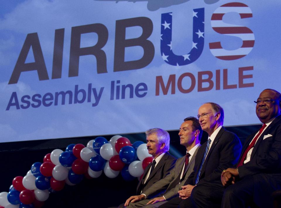 Officials attend ceremonies announcing that Airbus will establish its first assembly plant in the United States in Mobile, Ala., Monday, July 2, 2012. From left: Barry Eccleston, Airbus President & CEO Fabrice Bregier, Alabama Gov. Robert Bentley and Mobile, Ala. Mayor Sam Jones. The French-based company said the Alabama plant is expected to cost $600 million to build and will employ 1,000 people when it reaches full production, likely to be four planes a month by 2017. (AP Photo/Dave Martin)