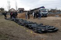 FILE PHOTO: Exhumation of bodies of civilians from a mass grave in Bucha