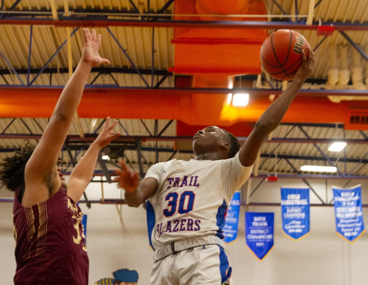 Americas forward Lareon Johnson goes up for a layup against Andress at Americas High School on Nov. 20, 2023