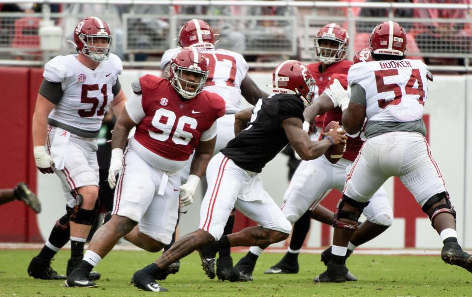 Apr 16, 2022; Tuscaloosa, Alabama, USA;  Crimson defensive lineman Tim Keenan III (96) rushes as White quarterback Jalen Milroe (2) evades the rush during the A-Day game at Bryant-Denny Stadium. Mandatory Credit: Gary Cosby Jr.-USA TODAY Sports