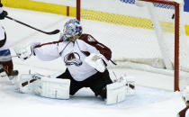 A shot by Minnesota Wild defenseman Jared Spurgeon gets past Colorado Avalanche goalie Semyon Varlamov (1), of Russia, for a goal during the first period of Game 4 of an NHL hockey first-round playoff series in St. Paul, Minn., Thursday, April 24, 2014. (AP Photo/Ann Heisenfelt)