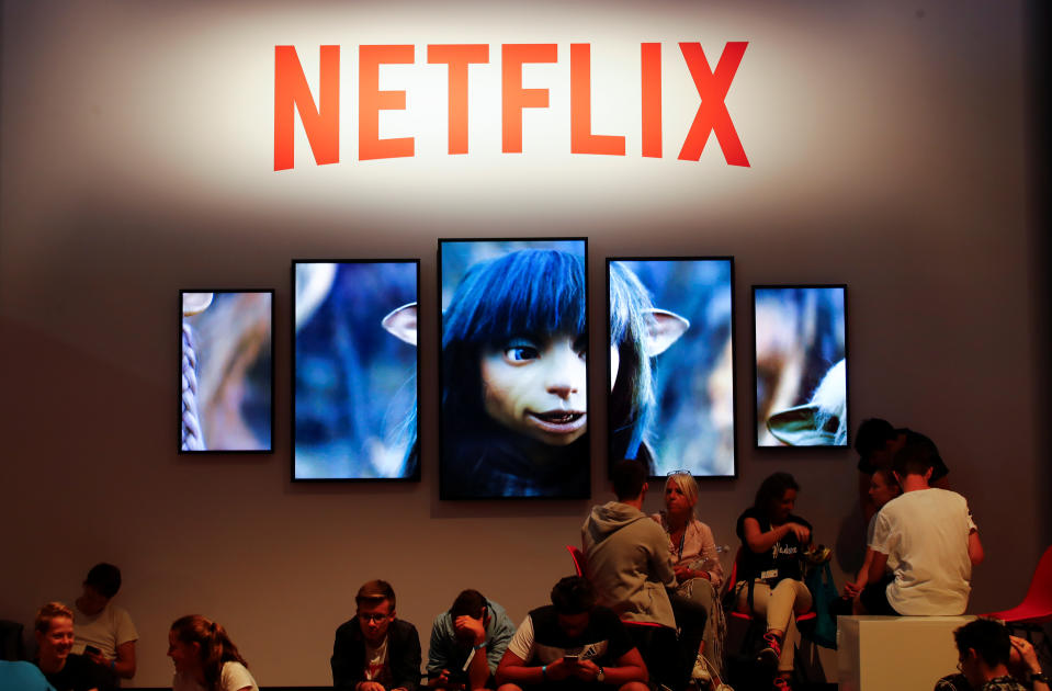 Gamers and visitors take a rest at the booth of Netflix during Europe's leading digital games fair Gamescom, which showcases the latest trends of the computer gaming scene in Cologne, Germany, August 21, 2019. REUTERS/Wolfgang Rattay