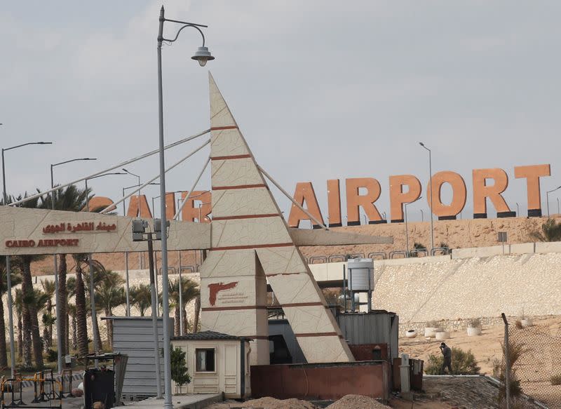 An Egyptian security member walks near the security gate of the Cairo's Internatonal Airport, following ramps up its efforts to slow the spread the coronavirus disease (COVID-19) in Cairo