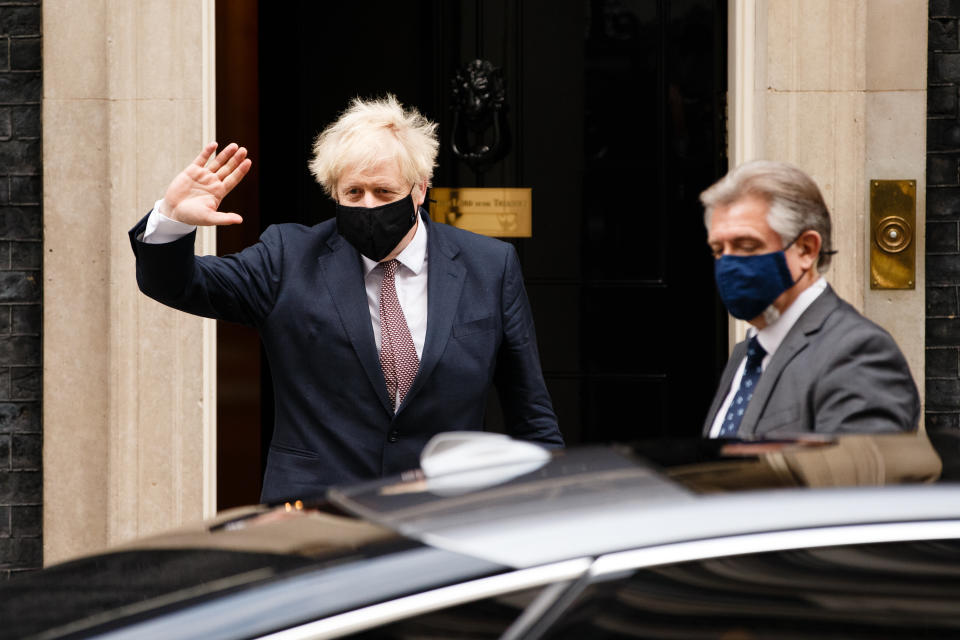 British Prime Minister Boris Johnson, Conservative Party leader and MP for Uxbridge and South Ruislip, wears a face mask leaving 10 Downing Street in London, England, on November 26, 2020. Johnson has been self-isolating for the last two weeks following notification by the National Health Service's 'track and trace' programme of contact at a Downing Street function with a fellow Conservative Party MP who later tested positive for coronavirus. The government is today meanwhile announcing which of the three 'tiers' of covid-19 restrictions will apply to local authorities across England at the end of the current national lockdown next week. (Photo by David Cliff/NurPhoto via Getty Images)