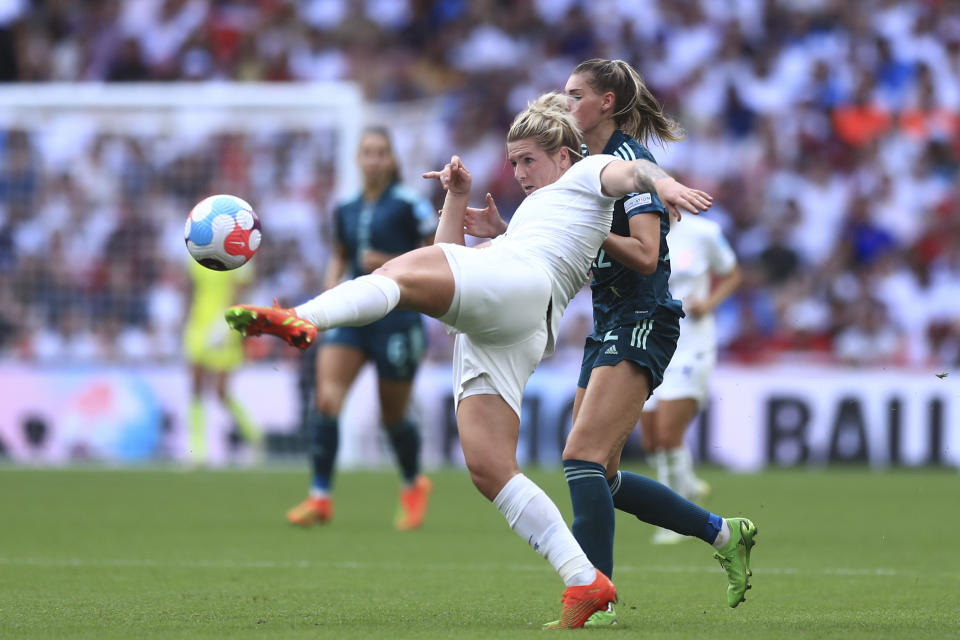 FILE - England's Millie Bright, left, challenges for the ball with Germany's Jule Brand during the Women's Euro 2022 final soccer match between England and Germany at Wembley stadium in London, Sunday, July 31, 2022. (AP Photo/Leila Coker, File)