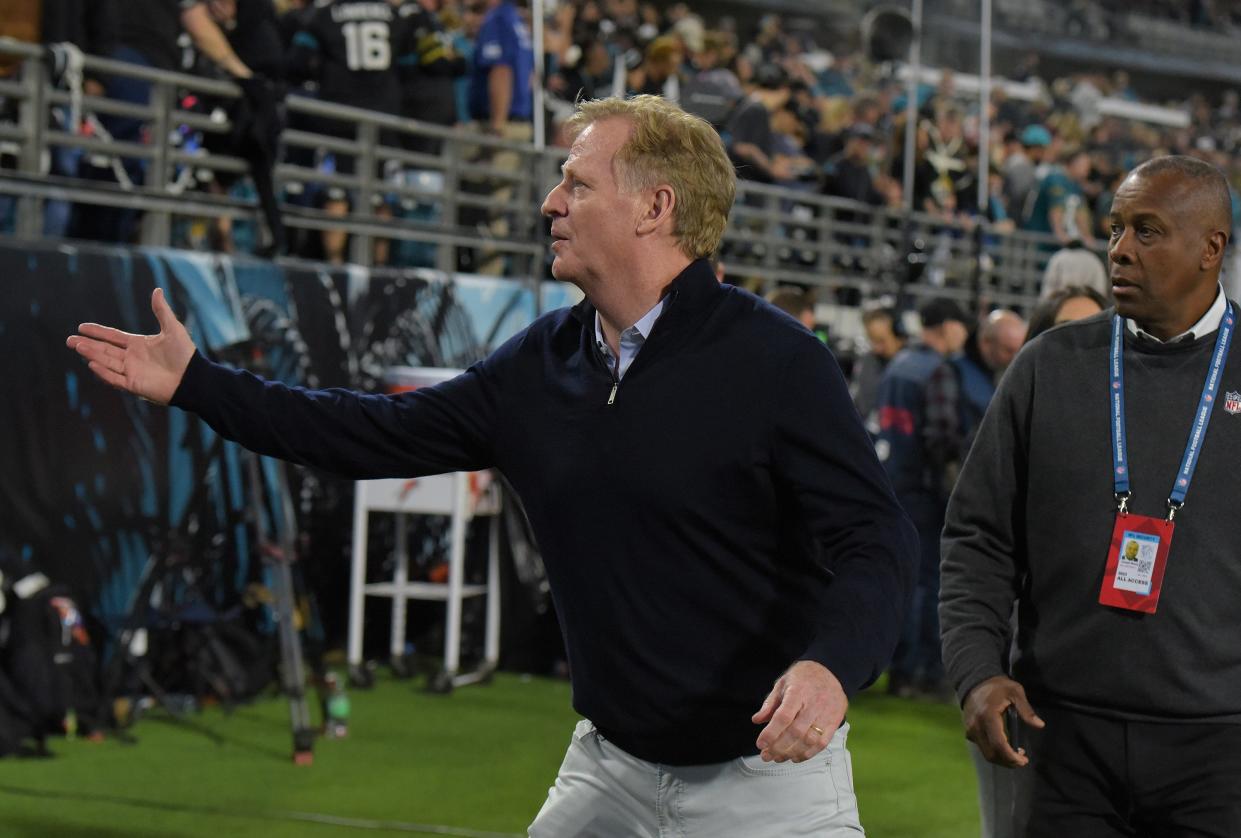 NFL commissioner Roger Goodell talks with fans from the sidelines before the start of Monday night's Jaguars game against the Bengals in Jacksonville at EverBank Stadium. Goodell also met with City Council President Ron Salem before the game.