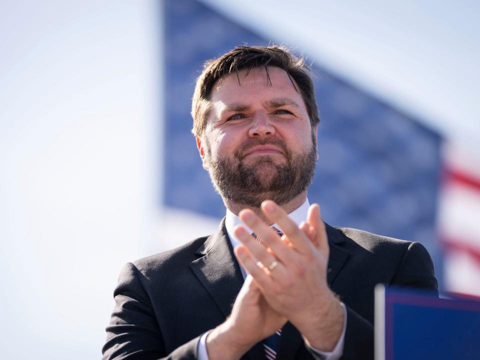 JD Vance arrives onstage during a rally hosted by former President Donald Trump