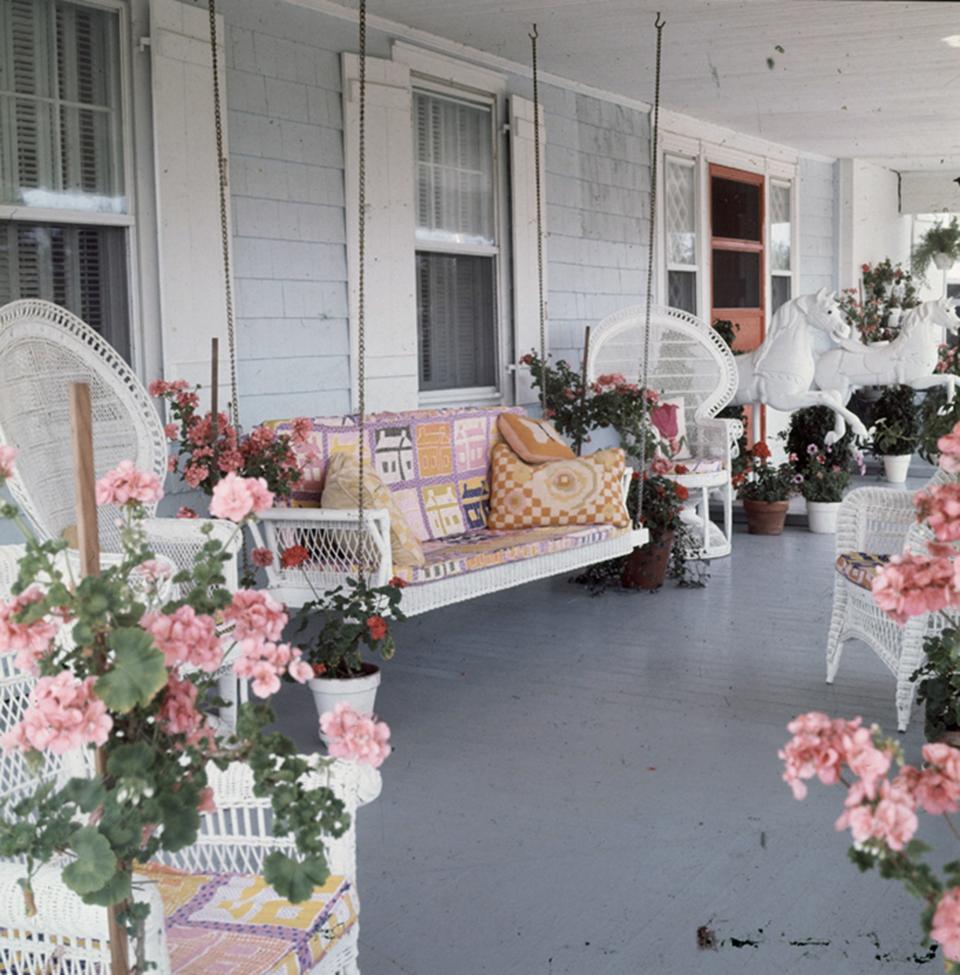 <h1 class="title">The front porch of Gloria Vanderbilt and Wyatt Cooper’s Long Island home</h1><cite class="credit">Photographed by Horst P. Horst, <em>Vogue</em>, April 1971</cite>